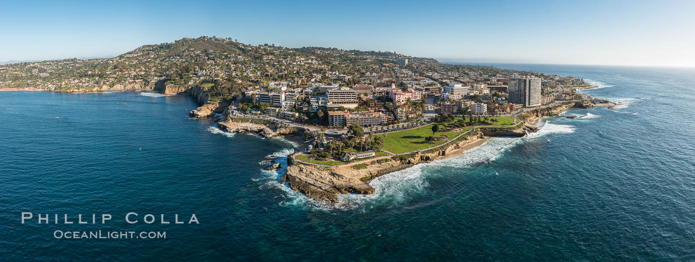 Aerial Panoramic Photo of Point La Jolla and La Jolla Cove, Boomer Beach, Scripps Park. Panoramic aerial photograph of La Jolla Cove and Scripps Parks (center), with La Jolla’s Mount Soledad rising above, La Jolla Shores and La Jolla Caves to the left and the La Jolla Coast with Children’s Pool (Casa Cove) to the right. The undersea reefs of Boomer Beach are seen through the clear, calm ocean waters. This extremely high resolution panorama will print 50″ high by 130″ long with no interpolation. California, USA, natural history stock photograph, photo id 30773