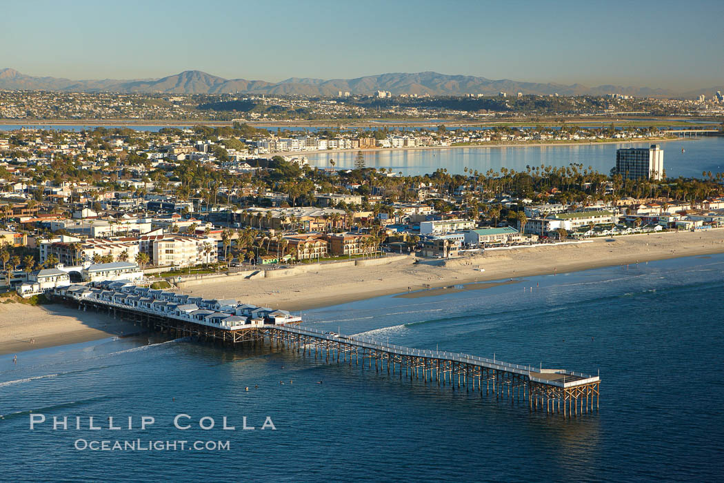 Crystal Pier, 872 feet long and built in 1925, extends out into the Pacific Ocean from the town of Pacific Beach.  Mission Bay and downtown San Diego are seen in the distance. California, USA, natural history stock photograph, photo id 22294