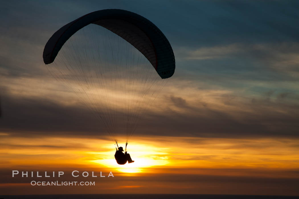 Paraglider soaring at Torrey Pines Gliderport, sunset, flying over the Pacific Ocean. La Jolla, California, USA, natural history stock photograph, photo id 24286