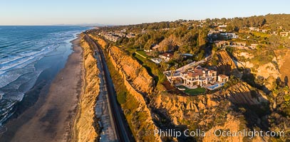 Aerial Photo of Del Mar Coastline, North County, San Diego, including train tracks running along the edge of the sea cliffs above the Pacific Ocean