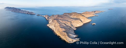 Aerial photo of Islas San Lorenzo in the Sea of Cortez. San Lorenzo Marine Archipelago National Park is a national park of Mexico located on San Lorenzo Island part of an archipelago in the Gulf of California off the eastern coast of Baja California. The San Lorenzo Archipelago is considered one of the most important ecological areas of the Gulf of California. The Island and surrounding areas are part of a rich ecosystem comprised by a grand variety of flora and marine fauna. This area is protected by the Mexican federal government Norma Oficial Mexicana because of its importance as a habitat for several endangered species