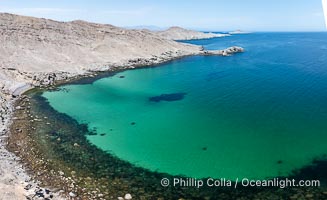 Aerial photo of Islas San Lorenzo in the Sea of Cortez. San Lorenzo Marine Archipelago National Park is a national park of Mexico located on San Lorenzo Island part of an archipelago in the Gulf of California off the eastern coast of Baja California. The San Lorenzo Archipelago is considered one of the most important ecological areas of the Gulf of California. The Island and surrounding areas are part of a rich ecosystem comprised by a grand variety of flora and marine fauna. This area is protected by the Mexican federal government Norma Oficial Mexicana because of its importance as a habitat for several endangered species