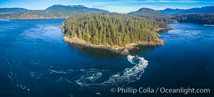 Seymour Narrows with strong tidal currents.  Between Vancouver Island and Quadra Island, Seymour Narrows is about 750 meters wide and has currents reaching 15 knots.  Aerial photo