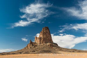 Agaltha Peak, also know as El Capitan Peak, rises to over 1500' in height near Kayenta, Arizona and Monument Valley.  Agathla Peak is an eroded volcanic plug consisting of volcanic breccia cut by dikes of an unusual igneous rock called minette