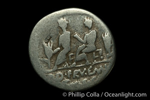 Ancient Roman coin, minted by L.C. Piso / Q.S. Caaepio (100 B.C.), (silver, denom/type: Denarius) (Denarius Cr-330/1, Syd-603, Calpurnia-5. Obverse: Head of Saturn right. Reverse: The two quaesters standing left, between two ears of corn.)