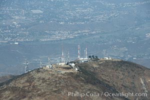 Antenna towers atop San Miguel Mountain, aerial view.  San Miguel Mountain reaches an altitude of 2565 feet, and hosts commercial radio and television antennas for the San Diego region, east of downtown San Diego