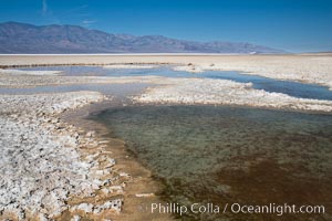 Badwater, California.  Badwater, at 282 feet below sea level, is the lowest point in North America.  9000 square miles of watershed drain into the Badwater basin, to dry and form huge white salt flats, Death Valley National Park