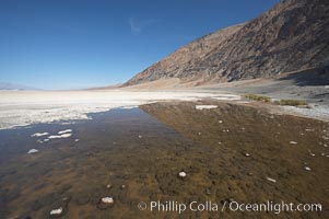 Badwater, California.  Badwater, at 282 feet below sea level, is the lowest point in North America.  9000 square miles of watershed drain into the Badwater basin, to dry and form huge white salt flats, Death Valley National Park