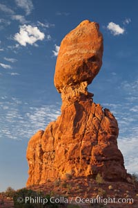 Balanced Rock, a narrow sandstone tower, appears poised to topple, Arches National Park, Utah