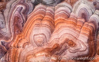 Fantastic colorful sedimentary patterns, Bentonite layers are seen as striations exposed in the Utah Badlands. The Bentonite Hills are composed of the Brushy Basin shale member of the Morrison Formation. This layer was formed during Jurassic times when mud, silt, fine sand, and volcanic ash were deposited in swamps and lakes. Aerial photograph