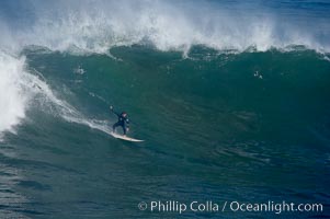 Andrew Matthews rides a big La Jolla Cove.  La Jolla Cove only breaks on really big swells.  Giant surf and big waves nail Southern California, December 21, 2005