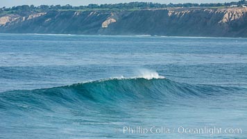 Boomer Beach wave, winter swell, La Jolla, Black's Beach and Torrey Pines in the distance