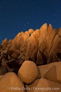 Boulders and stars, moonlight in Joshua Tree National Park. The moon gently lights unusual boulder formations at Jumbo Rocks in Joshua Tree National Park, California