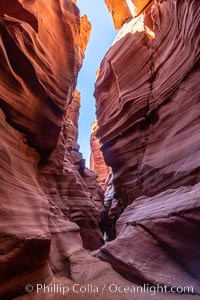 Canyon X, a spectacular slot canyon near Page, Arizona.  Slot canyons are formed when water and wind erode a cut through a (usually sandstone) mesa, producing a very narrow passage that may be as slim as a few feet and a hundred feet or more in height