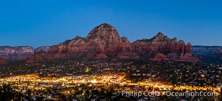 Capital Butte night panorama, the town of Sedona lighting up valley below, Arizona