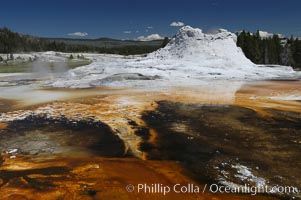 Sinter cone of Castle Geyser, estimated to be 5,000 - 15,000 years old.  Tortoise Shell Spring in foreground. Upper Geyser Basin, Yellowstone National Park, Wyoming