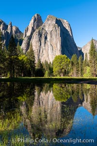 Cathedral Rocks at sunrise, reflected in a spring meadow flooded by the Merced River, Yosemite National Park, California