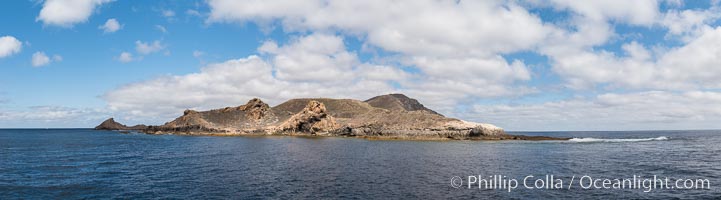 San Clemente Island, south end showing China Hat (Balanced Rock) and Pyramid Head, near Pyramic Cove, storm clouds. Panoramic photo