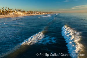 The coast of Oceanside California, waves and surfers, beach houses, just before sunset, winter, looking south, Oceanside Pier