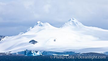 Coronation Island, is the largest of the South Orkney Islands, reaching 4,153' (1,266m) above sea level.  While it is largely covered by ice, Coronation Island also is home to some tundra habitat, and is inhabited by many seals, penguins and seabirds