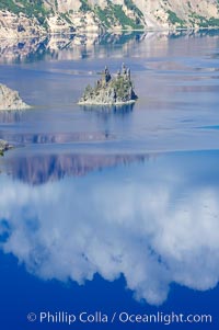 Phantom Ship, Crater Lake. Crater Lake is the six-mile wide lake inside the collapsed caldera of volcanic Mount Mazama, Crater Lake National Park, Oregon