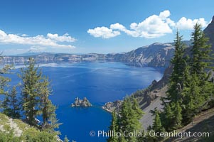 Crater Lake and Phantom Ship. Crater Lake is the six-mile wide lake inside the collapsed caldera of volcanic Mount Mazama, Crater Lake National Park, Oregon