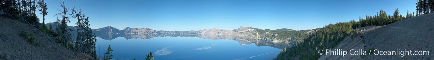 Panorama of Crater Lake, early morning.  Crater Lake is the six-mile wide lake inside the collapsed caldera of volcanic Mount Mazama. Crater Lake is the deepest lake in the United States and the seventh-deepest in the world. Its maximum recorded depth is 1996 feet (608m). It lies at an altitude of 6178 feet (1880m), Crater Lake National Park
