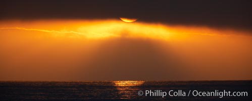 Dawn, sun peeks through morning clouds, Guadalupe Island (Isla Guadalupe)