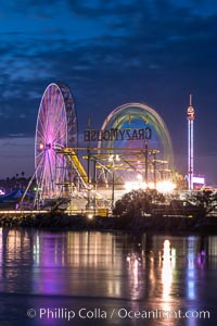 Del Mar Fair and San Dieguito Lagoon at Night.  Lights from the San Diego Fair reflect in San Dieguito Lagooon, with the train track trestles to the left