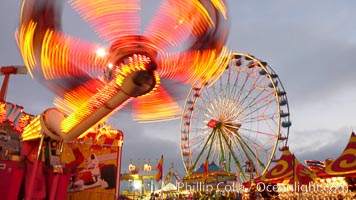 Ferris wheel and fair rides at sunset, blurring due to long exposure, Del Mar Fair