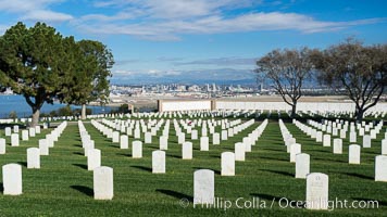 Tombstones at Fort Rosecrans National Cemetery, with downtown San Diego in the distance