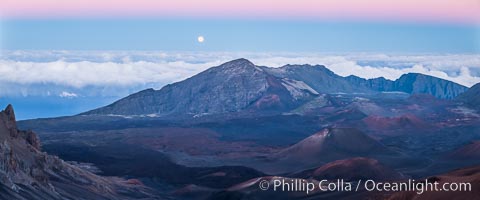 Full Moon and Earth Shadow over Haleakala crater, Maui, Hawaii.  The dark band on the horizon is the shadow of the earth, while the lighter pink band is atmosphere that is still lit by the setting sun