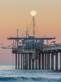 Full Moon Setting Over SIO Pier in the moments just before sunrise, Scripps Institution of Oceanography, La Jolla, California