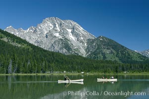 Canoers paddle across String Lake below Mount Moran, Grand Teton National Park, Wyoming