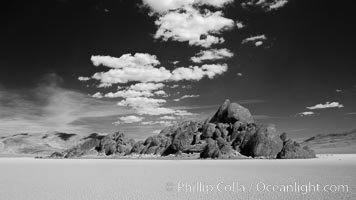 The Grandstand, standing above dried mud flats, on the Racetrack Playa in Death Valley, Death Valley National Park, California