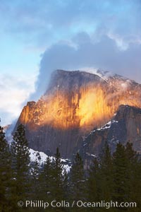 Half Dome and storm clouds at sunset, viewed from Sentinel Bridge, Yosemite National Park, California