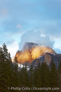 Half Dome and storm clouds at sunset, viewed from Sentinel Bridge, Yosemite National Park, California