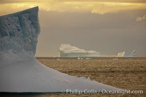 Iceberg, ocean, light and clouds.  Light plays over icebergs and the ocean near Coronation Island