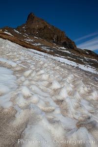 Crested snow patterns along the slopes of Devil Island
