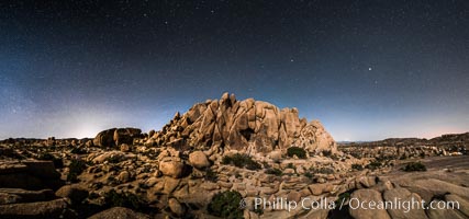 Jumbo Rocks and Stars at Night, landscape lit by a full moon, Joshua Tree National Park, California