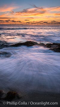 La Jolla coast sunset, waves wash over sandstone reef, clouds and sky, d 0.402760 0.496781