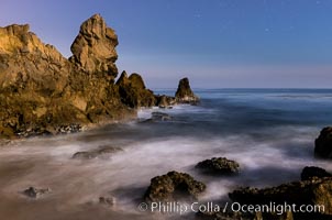 Little Corona Beach, at night under a full moon, waves lit by moonlight, Newport Beach, California