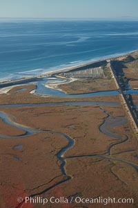 Los Penasquitos Marsh, seen from above along the coast south of Del Mar, where it exchanges fresh and salt water iwith the Pacific Ocean along Torrey Pines State Beach, San Diego, California