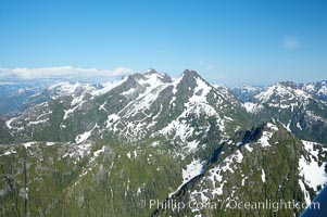 Mariner Mountain, viewed from the northwest, on the west coast of Vancouver Island, British Columbia, Canada, part of Strathcona Provincial Park, located 36 km (22 mi) north of Tofino.  It is 1,771 m (5,810 ft) high, snow covered year-round and home to several glaciers