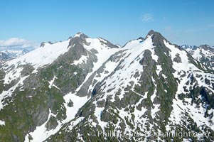 Mariner Mountain, viewed from the northwest, on the west coast of Vancouver Island, British Columbia, Canada, part of Strathcona Provincial Park, located 36 km (22 mi) north of Tofino.  It is 1,771 m (5,810 ft) high, snow covered year-round and home to several glaciers