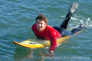 Ryan Seelbach paddles out to the lineup for his heat four surf, Seelbach would advance to the semis, Mavericks surf contest, February 7, 2006, Half Moon Bay, California