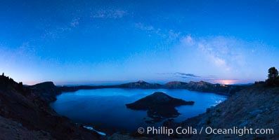 Milky Way and stars over Crater Lake at night. Panorama of Crater Lake and Wizard Island at night, Crater Lake National Park