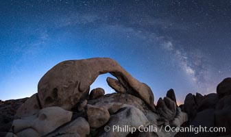 Milky Way over Arch Rock, planet Venus framed with the arch, at astronomical twilight, Joshua Tree National Park