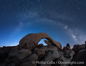 Milky Way over Arch Rock, planet Venus framed with the arch, at astronomical twilight, Joshua Tree National Park
