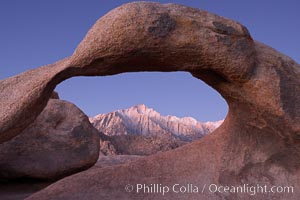 Mobius Arch at sunrise, framing snow dusted Lone Pine Peak and the Sierra Nevada Range in the background.  Also known as Galen's Arch, Mobius Arch is found in the Alabama Hills Recreational Area near Lone Pine